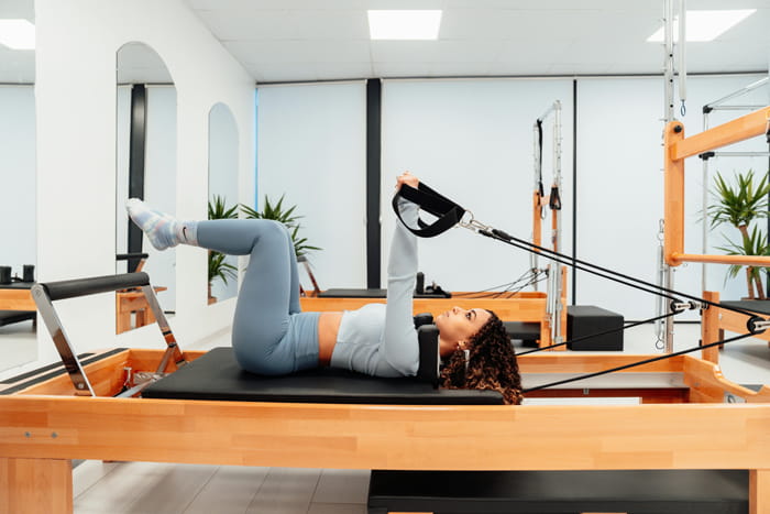 Girl excercising on equipment Girl excercising on equipment